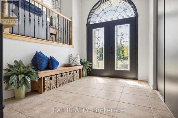 Interior view of the foyer with tiled floors and a wooden bench. - 140 Windmill Crescent, Beckwith