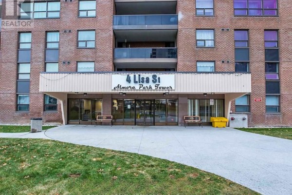 Exterior view of the apartment building showcasing multiple floors and balconies - 1401 - 4 Lisa Street, Brampton