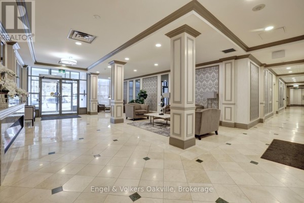 Lobby with marble floors, columns, and seating - 1402 - 442 Maple Avenue Burlington
