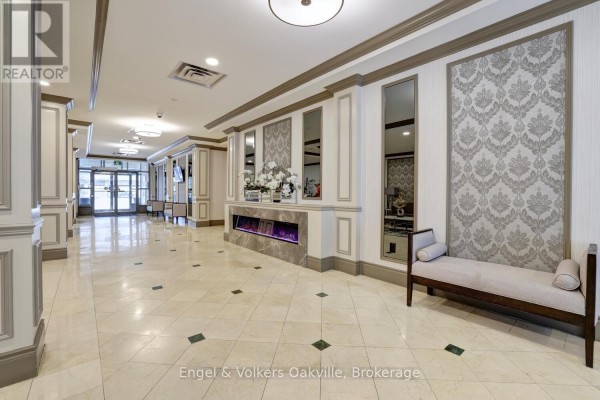 Fitness room with treadmills, stationary bikes, weight bench, and large windows. - 1402 - 442 Maple Avenue, Burlington