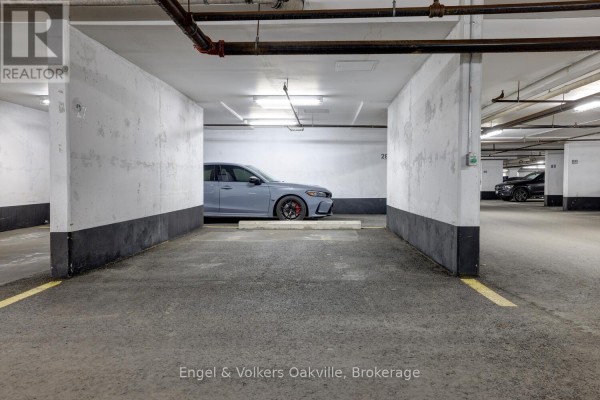 Underground parking spot 26 with grey car - 1402 - 442 Maple Avenue Burlington