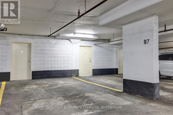 Parking garage space with doors and numbered column 87 - 1402 - 442 Maple Avenue Burlington