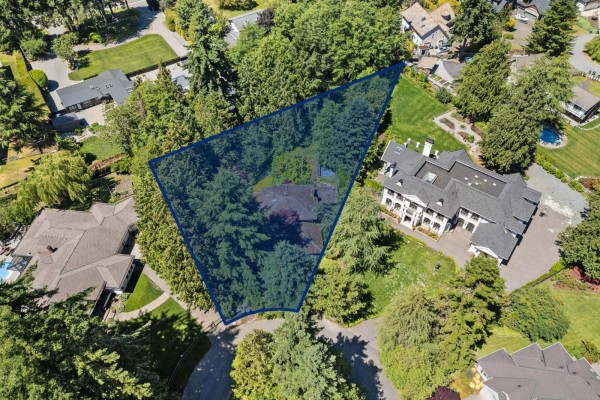 Aerial view showing the boundaries of a wooded property on 26a Avenue, Surrey, with a house in the center. - 14069 26a Avenue, Surrey