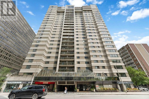 Front view of 199 Kent Street, Ottawa, a tall apartment building with a glass entrance. - 1409 - 199 Kent Street, Ottawa