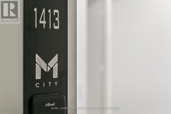 Close-up of unit number 1413 with modern design elements and branding. - 1413 - 3900 Confederation Parkway, Mississauga
