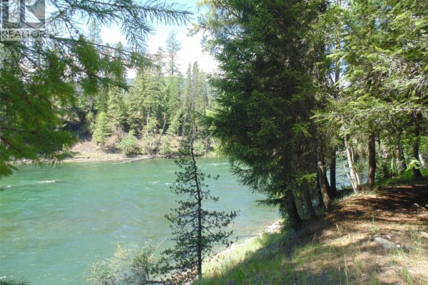 Wide green river flowing through a wooded area with tall trees. - 1415 Bridge Road, Crescent Valley