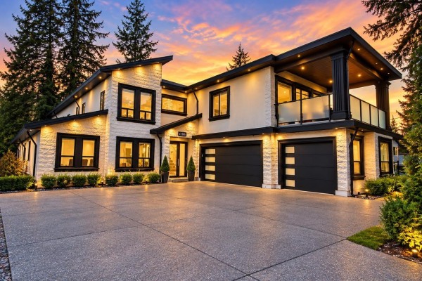 Front facade of a modern house with large windows and dark trim. - 14186 Melrose Drive, Surrey