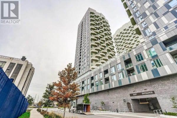 Exterior view of a high-rise condominium building with unique green balconies and stone facade. - 1419 - 10 Abeja Street, Vaughan