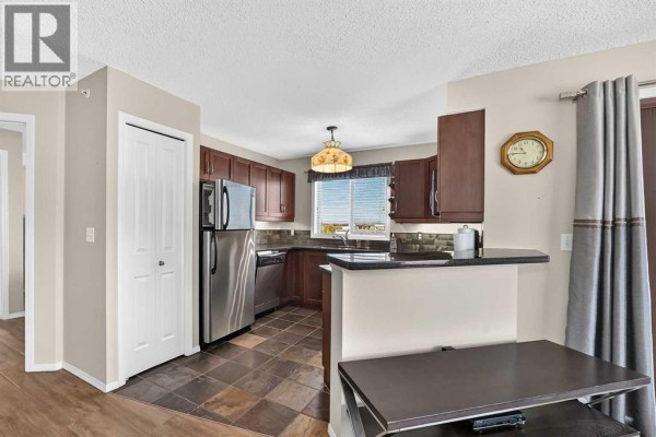 Laundry room - 1420, 505 Railway Street W, Cochrane, AB T4C2K9 Photo 4