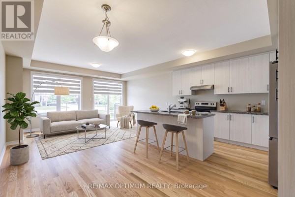 Empty room with large window and neutral carpet - 1420 Oakmont Common, Burlington