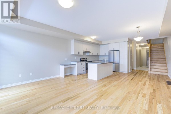 Basement utility area with red furnace and exposed ductwork - 1420 Oakmont Common, Burlington