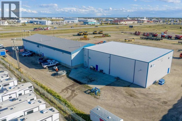 Aerial view of the commercial property, showing multiple buildings and RVs parked outside. - 14250 100 Street, Rural Grande Prairie No  1, County Of