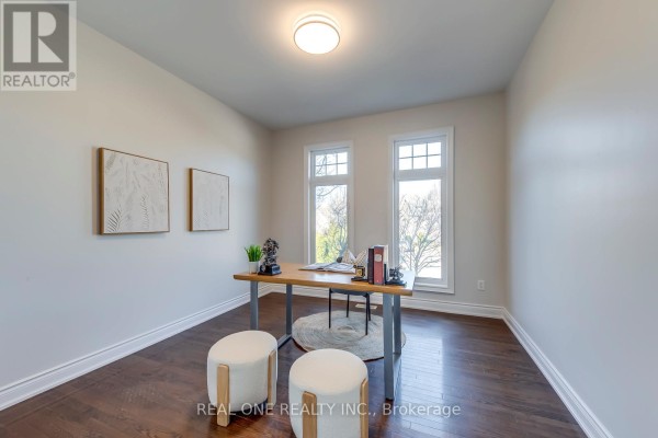 Home office with desk, ottomans, and art - 1426 Redwing Court Oakville
