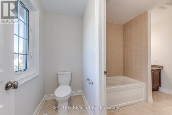 Bathroom with toilet, bathtub, and vanity - 1426 Redwing Court Oakville