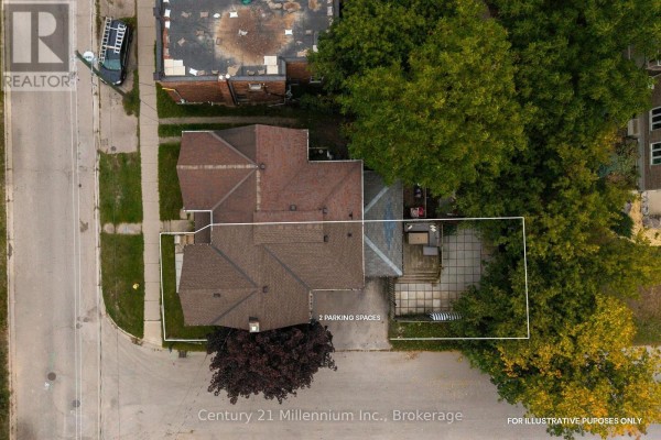 Aerial view of the property showing the roof, backyard patio, and two parking spaces. - 143 11th Street W, Owen Sound