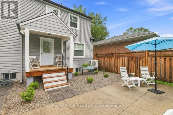 Covered porch, deck, and patio with outdoor seating - 143 Britannia Street Stratford