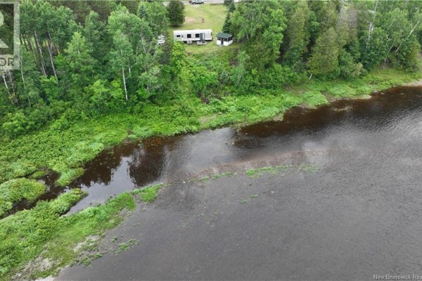 Aerial view of the river and its vegetated banks, with a small structure on the shore. - 145 Halcomb Road, Halcomb