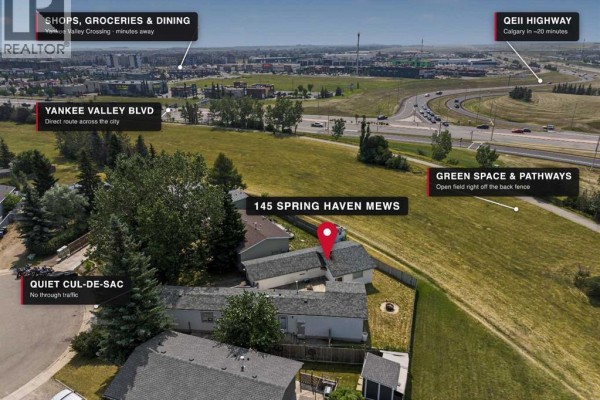Aerial view showing the property's proximity to green space, pathways, and highways. - 145 Spring Haven Mews Se, Airdrie