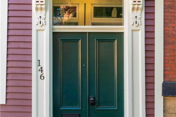 Close-up of a dark green double door with number 146 on the side. - 146 Germain Unit# Apt 2, Saint John