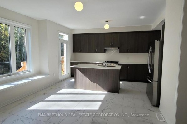 Interior entryway with white double doors, white closet doors, and marble tile flooring. - 147 Dovedale Drive, Georgina