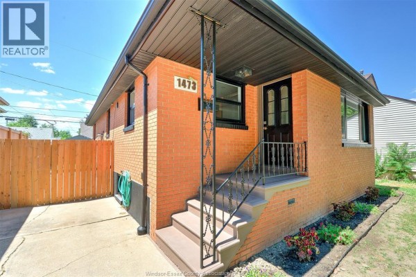 Close-up of the front entrance stairs and door of the brick house. - 1473 Labadie, Windsor