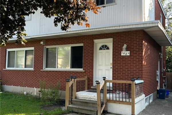 Two-story brick house with white siding and steps - 148 Weber Street N Unit# A Waterloo