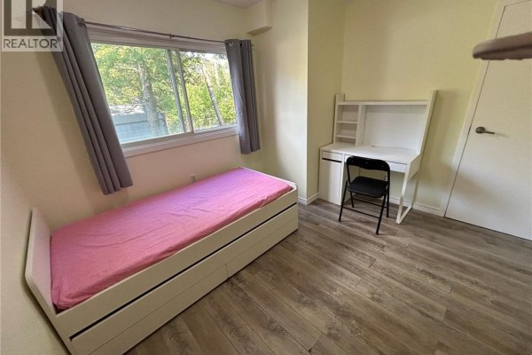 Bedroom with twin bed, desk, and chair - 148 Weber Street N Unit# A Waterloo
