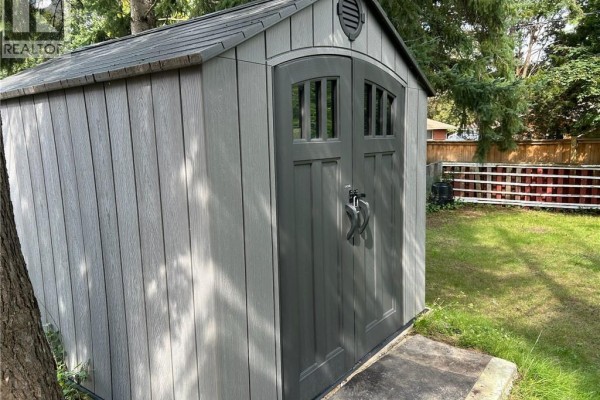 Modern grey storage shed with double doors and ventilation in backyard - 148 Weber Street N Unit# A Waterloo