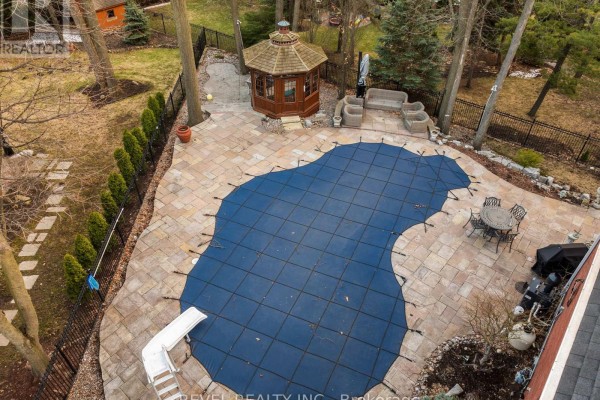 Backyard with covered pool, gazebo, and patio furniture - 1486 Ashwood Gate Pickering