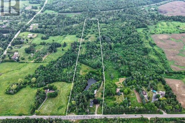 Aerial view of the property with a white outline highlighting a long, narrow section of land. - 14877 The Gore Road, Caledon