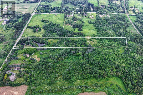 Aerial view of the property with a white outline highlighting a wide, rectangular section of land. - 14877 The Gore Road, Caledon