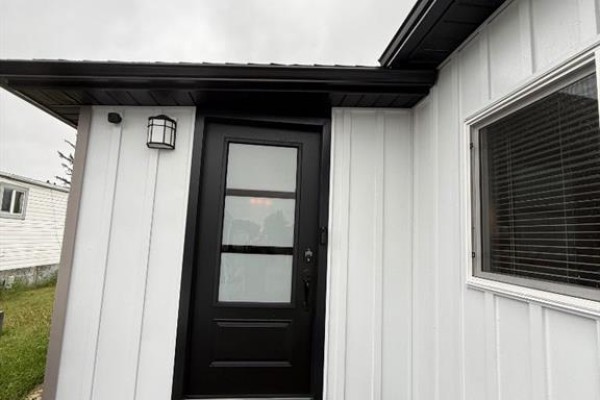 Close-up of the number 149 on the exterior of the house. - 149 Birch Street, Brooks