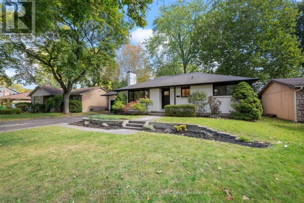Front yard landscaping with stone pathways leading to the front door of the bungalow. - 1492 North Vernon Avenue, London North