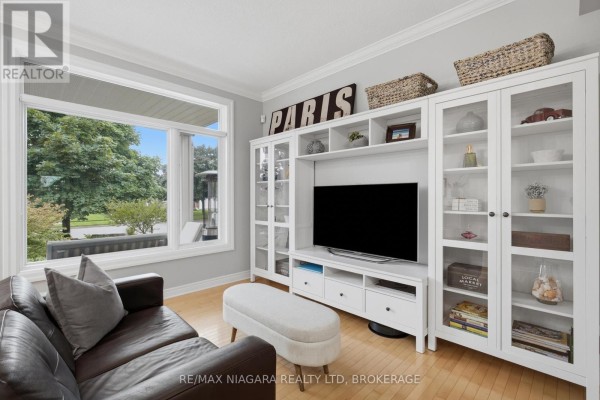 Leather sofa and built-in entertainment unit with television - 15 Cozocar Crescent St Catharines