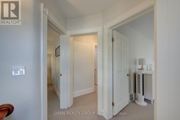 Hallway with white doors and carpet - 15 Gilholm Avenue Cambridge