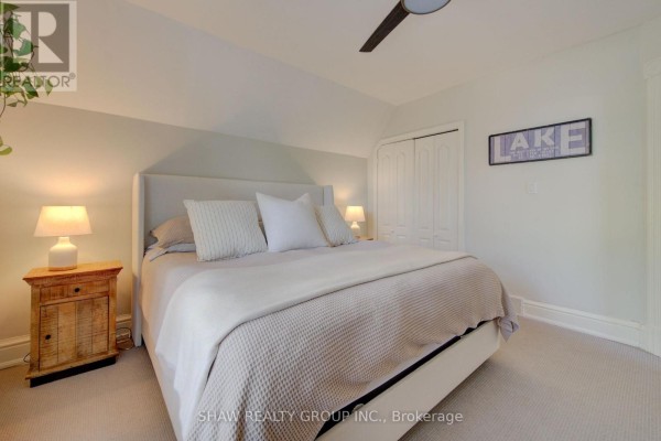 Bedroom with upholstered headboard bed and rustic nightstand - 15 Gilholm Avenue Cambridge