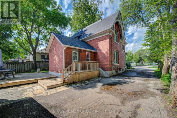 Brick house with wooden deck and flagstone patio - 15 Gilholm Avenue Cambridge