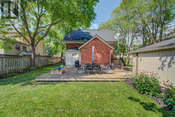 Backyard with wooden deck, dining set, and picnic table - 15 Gilholm Avenue Cambridge