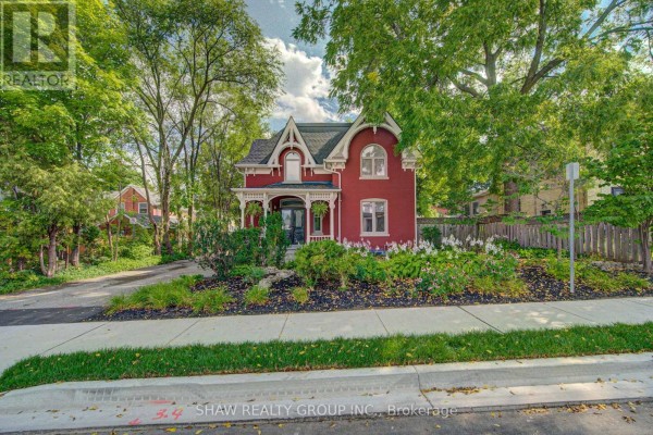 Red brick Victorian home with porch & landscaping - 15 Gilholm Avenue Cambridge