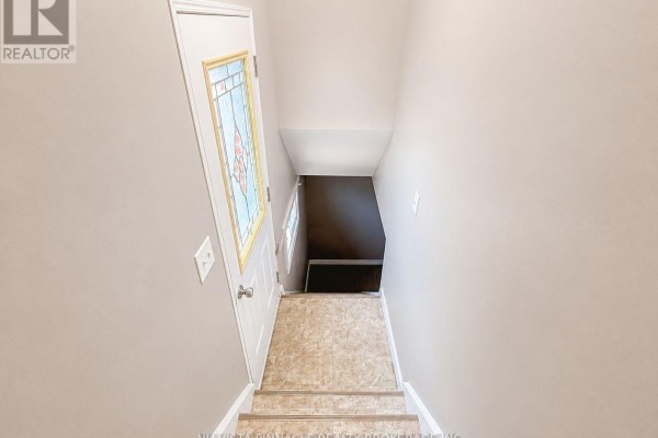 Stained glass door and staircase in hallway - 15 Gregory Place St Thomas