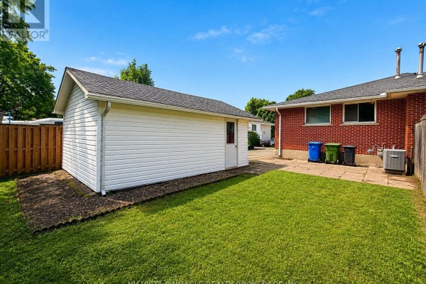 Detached garage and brick house backyard with patio - 15 Gregory Place St Thomas