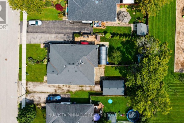 Aerial view of houses, lawns, driveway, and playground - 15 Gregory Place St. Thomas