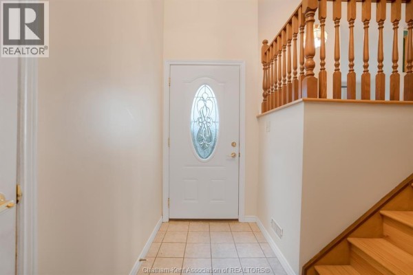 Backyard with a covered pool and fenced perimeter - 15 Monarch Drive, Chatham