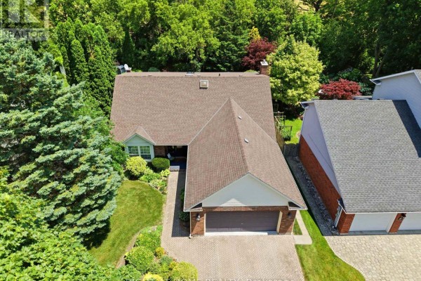 Aerial view showing the roofline and driveway of a detached residential home. - 15 The Promenade, Niagara On The Lake