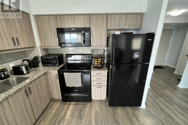 Kitchen - 1502 - 30 Meadowglen Place, Toronto, ON M1G0A6 Photo 3