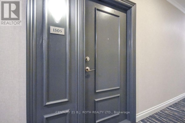Dark grey apartment door with a silver knob and the number 1505 above the door. - 1505 - 37 Ellen Street, Barrie