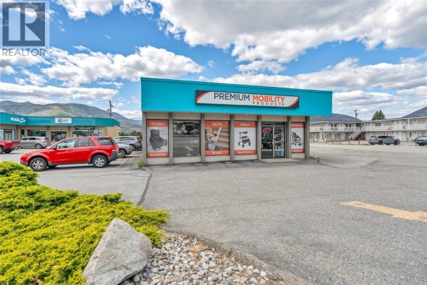 Front exterior of a retail store with teal siding and windows displaying mobility products. - 1505 Main Street, Penticton