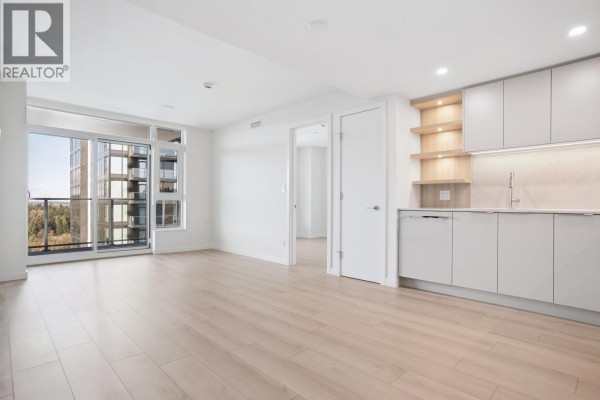 Empty living area with large glass doors leading to balcony - 1506 311 Alderson Avenue, Coquitlam