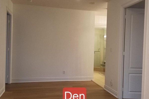 A common area with beige couches, a patterned carpet, and modern work cubicles. - 1507 - 60 South Town Centre Boulevard, Markham