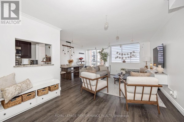 Lobby with marble flooring, large windows, and a reception desk. - 1512 - 2760 Carousel Crescent, Ottawa